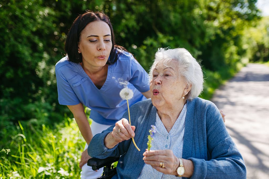 Healthcare worker with elderly resident